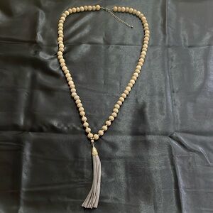 Grey wooden beaded leather tassel necklace